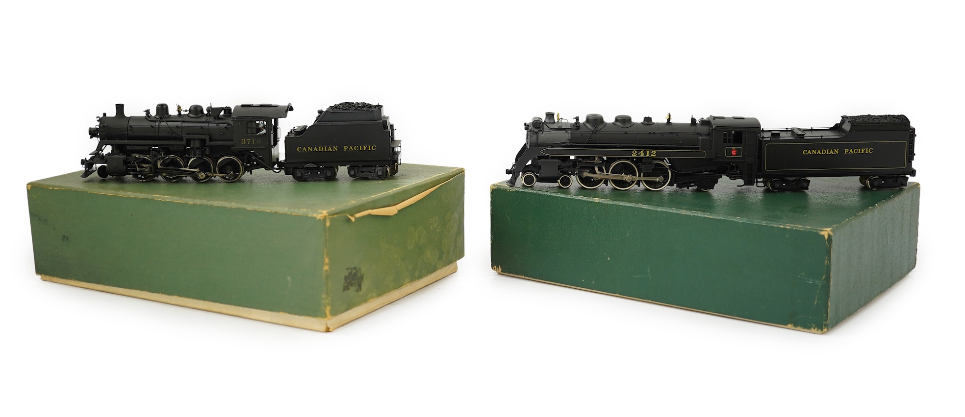 Two boxed HO gauge Canadian Pacific locomotives; a Toby of Japan model of 2412, 4-6-2 locomotive with bogie tender, together with a United Scale Models 3710, 2-8-0 locomotive with bogie tender, both powered for two rail